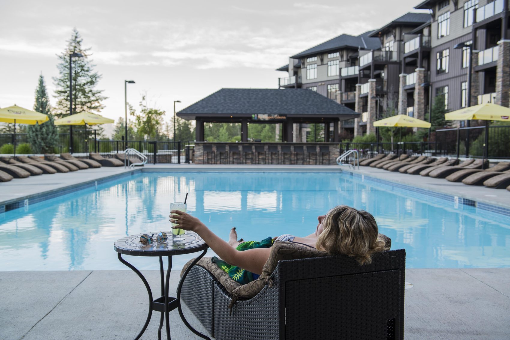 The outdoor pool, with loungers and a covered pavilion, and the hotel beyond